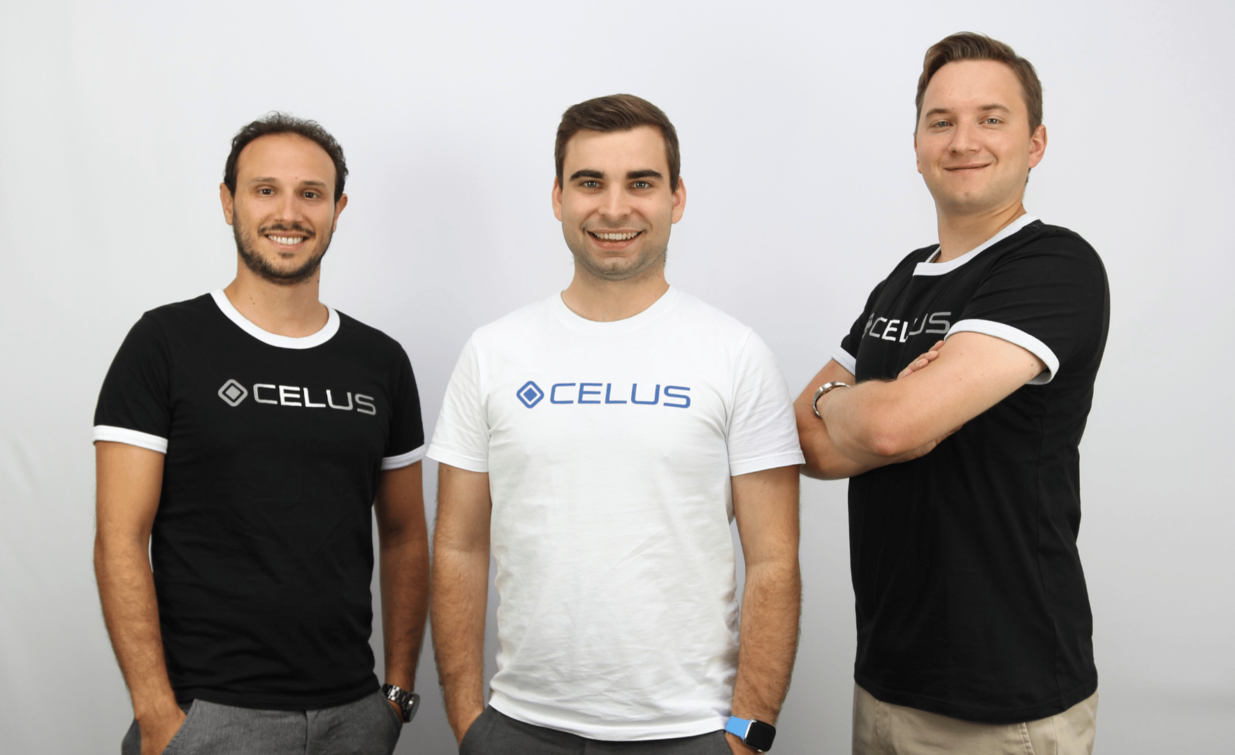 The three CELUS co-founders are standing next to each other. Two wear black and one wears a white t-shirt.